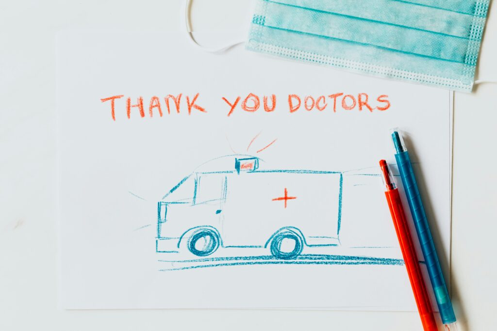 pexels-photo-4386600-4386600 A heartfelt drawing thanking doctors with an ambulance illustration, face mask, and pens.